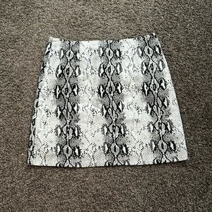 Mini skirt from she + sky in snake print!